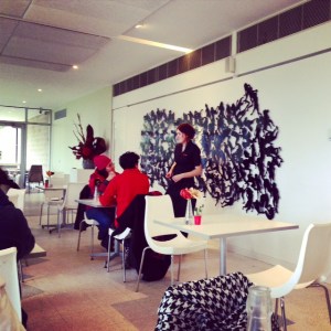 My friend chose her coat especially to coordinate with the cafe artwork